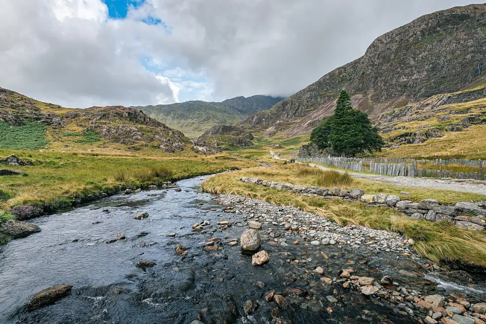 The ruined farm of Plas Cwm Llan and Gladstone Rock beside Afon Cwm Llan on the Watkin Path